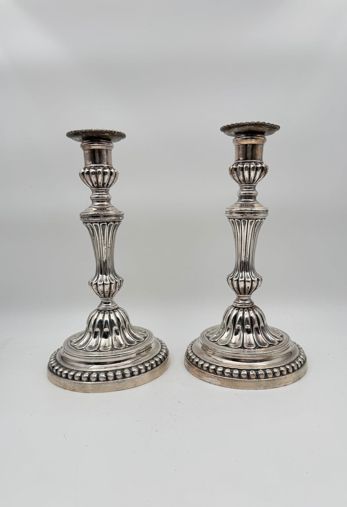 Pair of Louis XVI Style Silvered Metal Candlesticks – Elegant Neoclassical Design