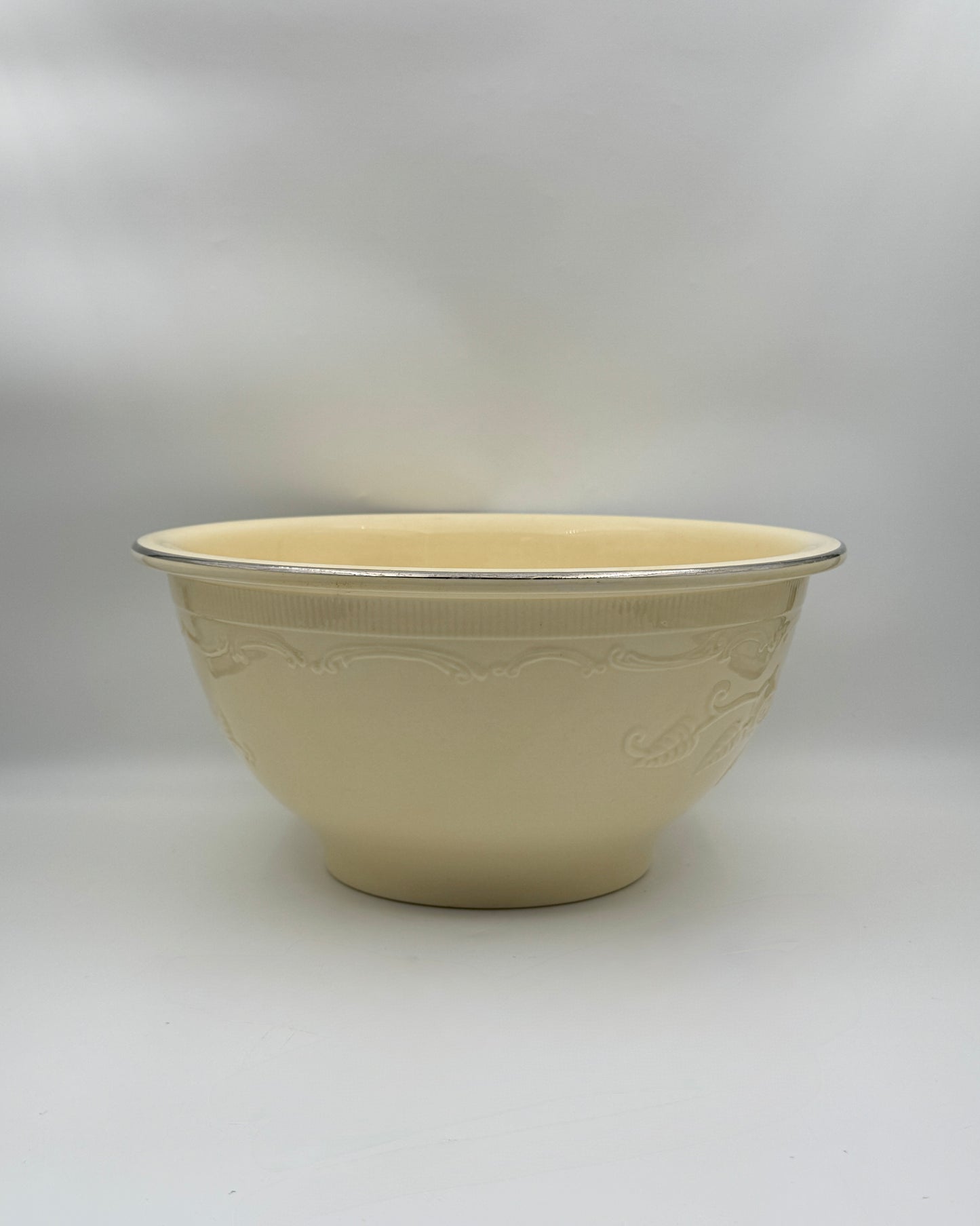 Homer Laughlin Embossed Serving Bowl – Buttery Yellow with Silver Rim