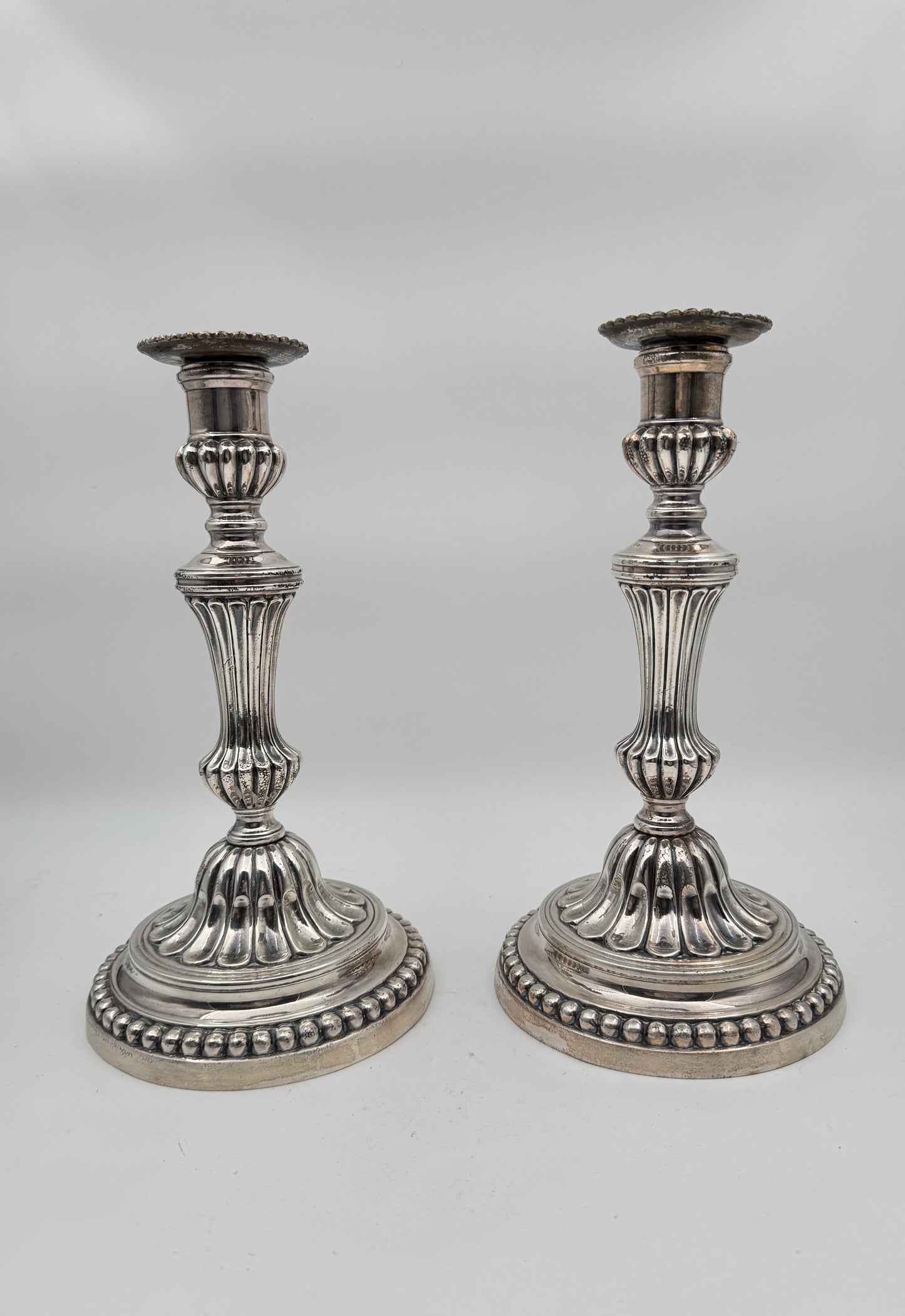Pair of Louis XVI Style Silvered Metal Candlesticks – Elegant Neoclassical Design