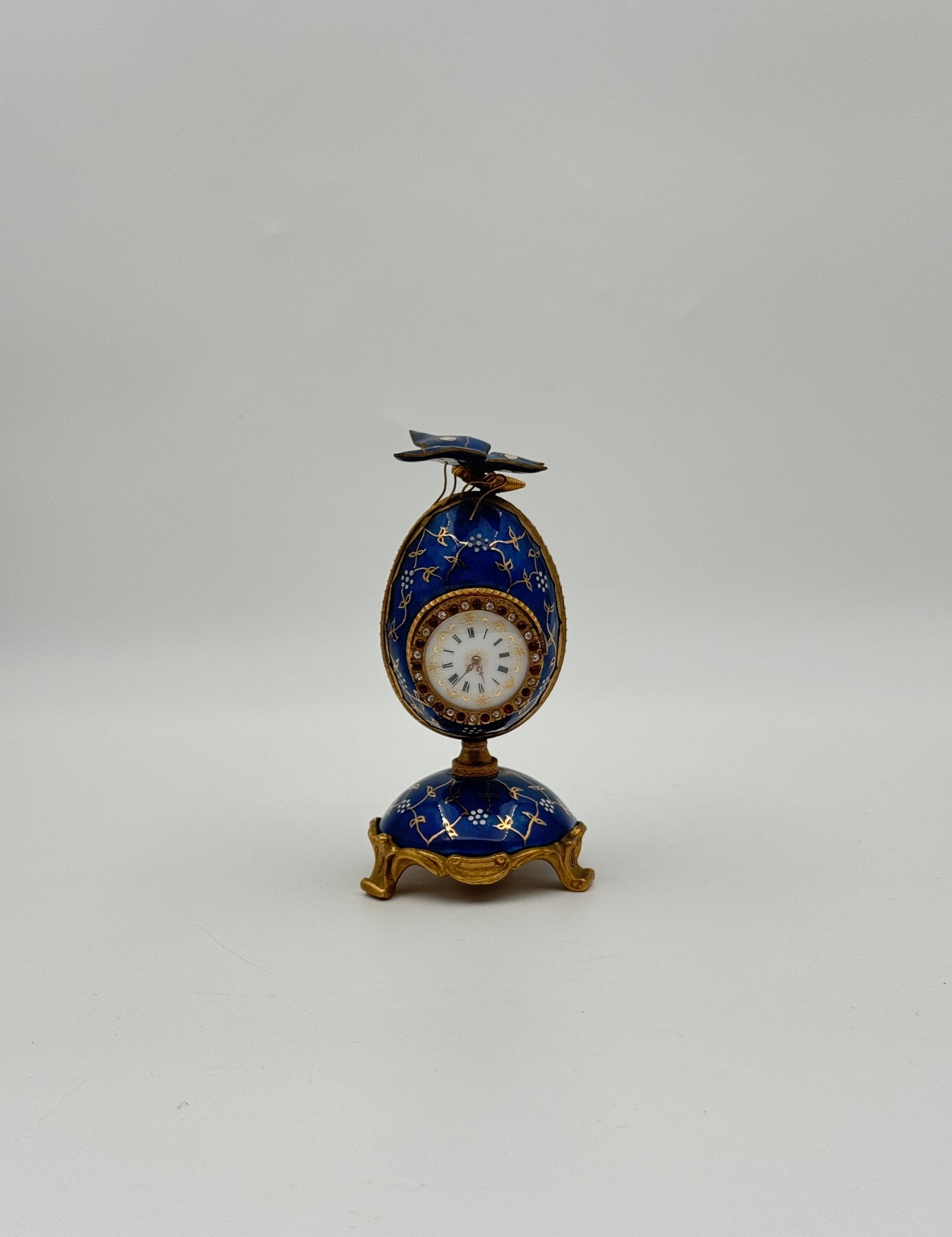 Blue Enamel Egg Clock with Butterfly Top – Gilt Accents
