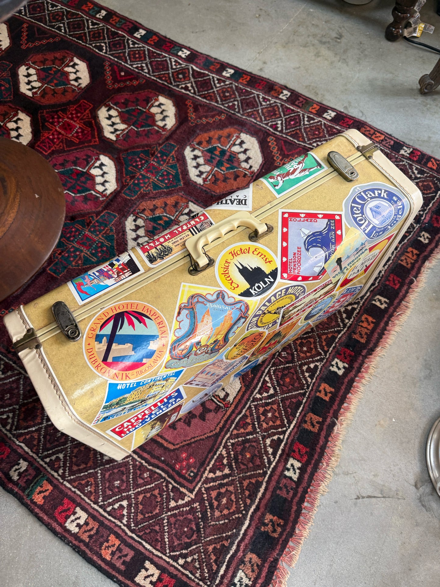Vintage Suitcase With Travel Stickers