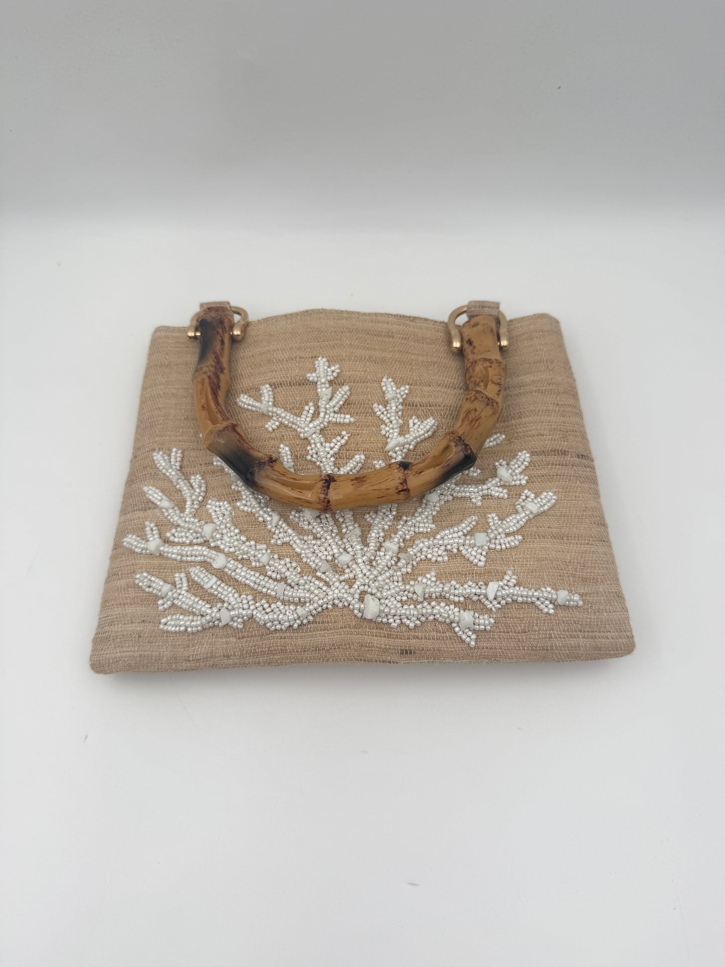Hand Beaded White Coral Clutch with Bamboo Handle on Raw Silk