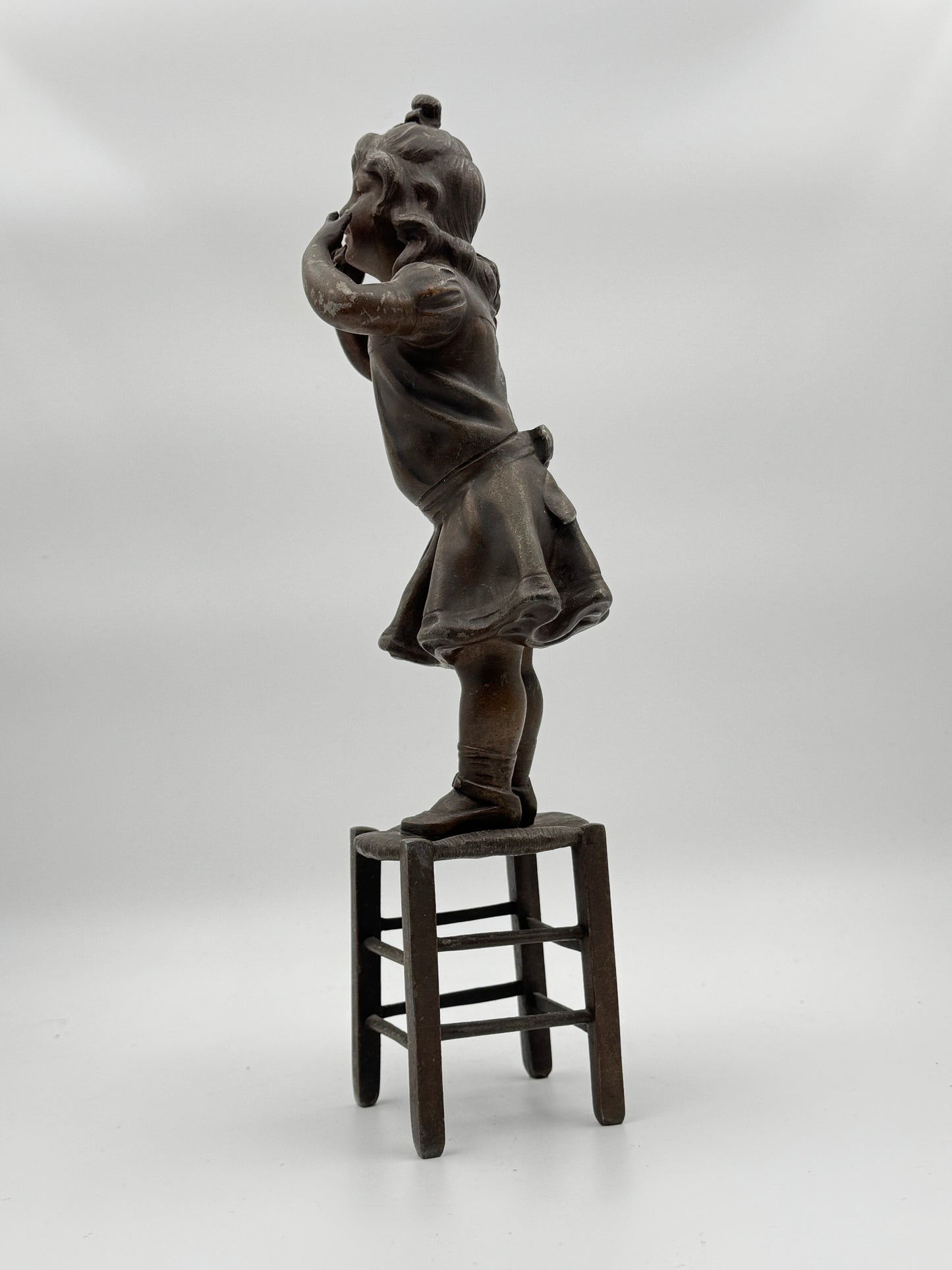 Vintage Patinated Metal Sculpture of a Girl Standing on a Chair