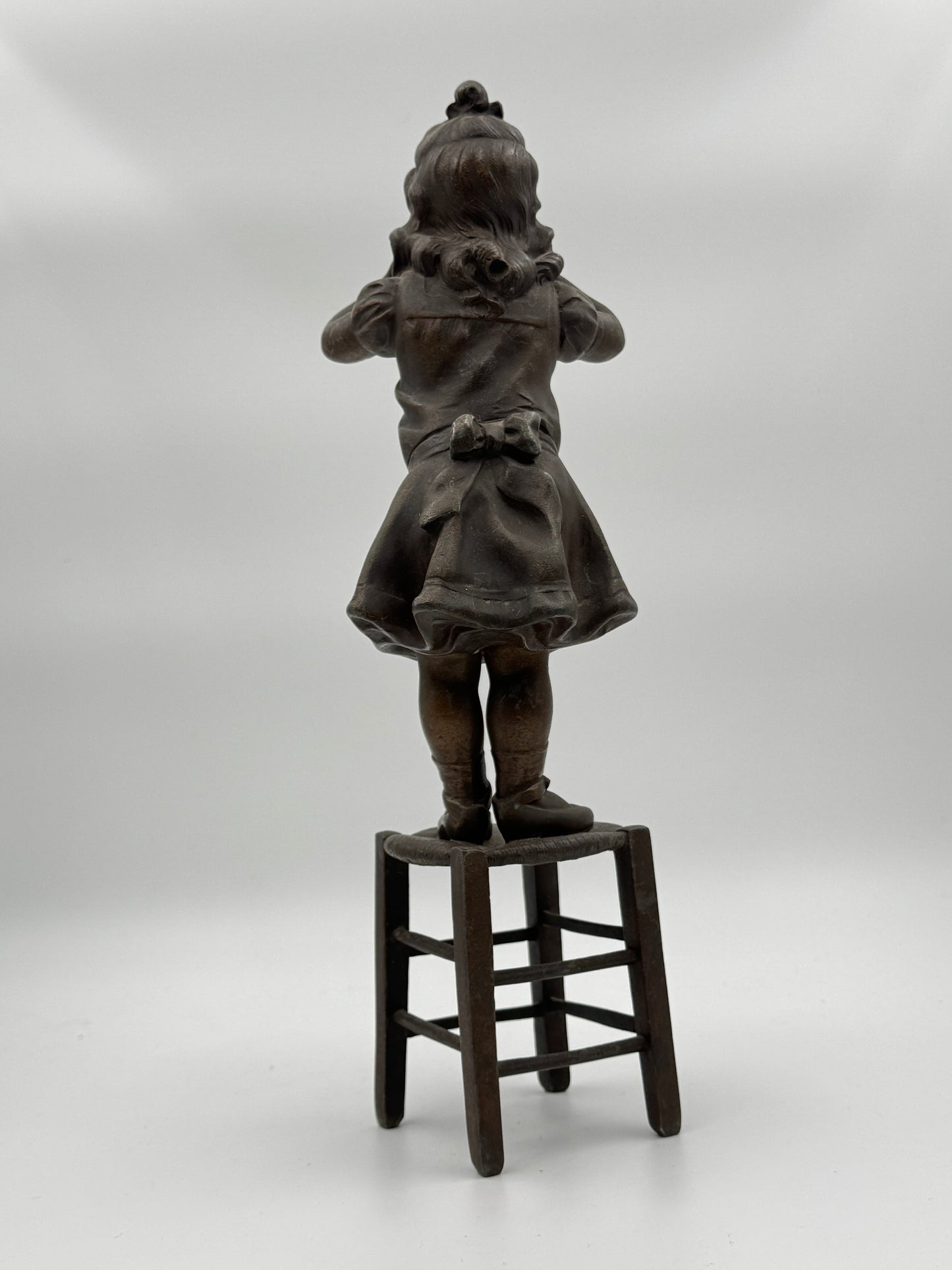 Vintage Patinated Metal Sculpture of a Girl Standing on a Chair