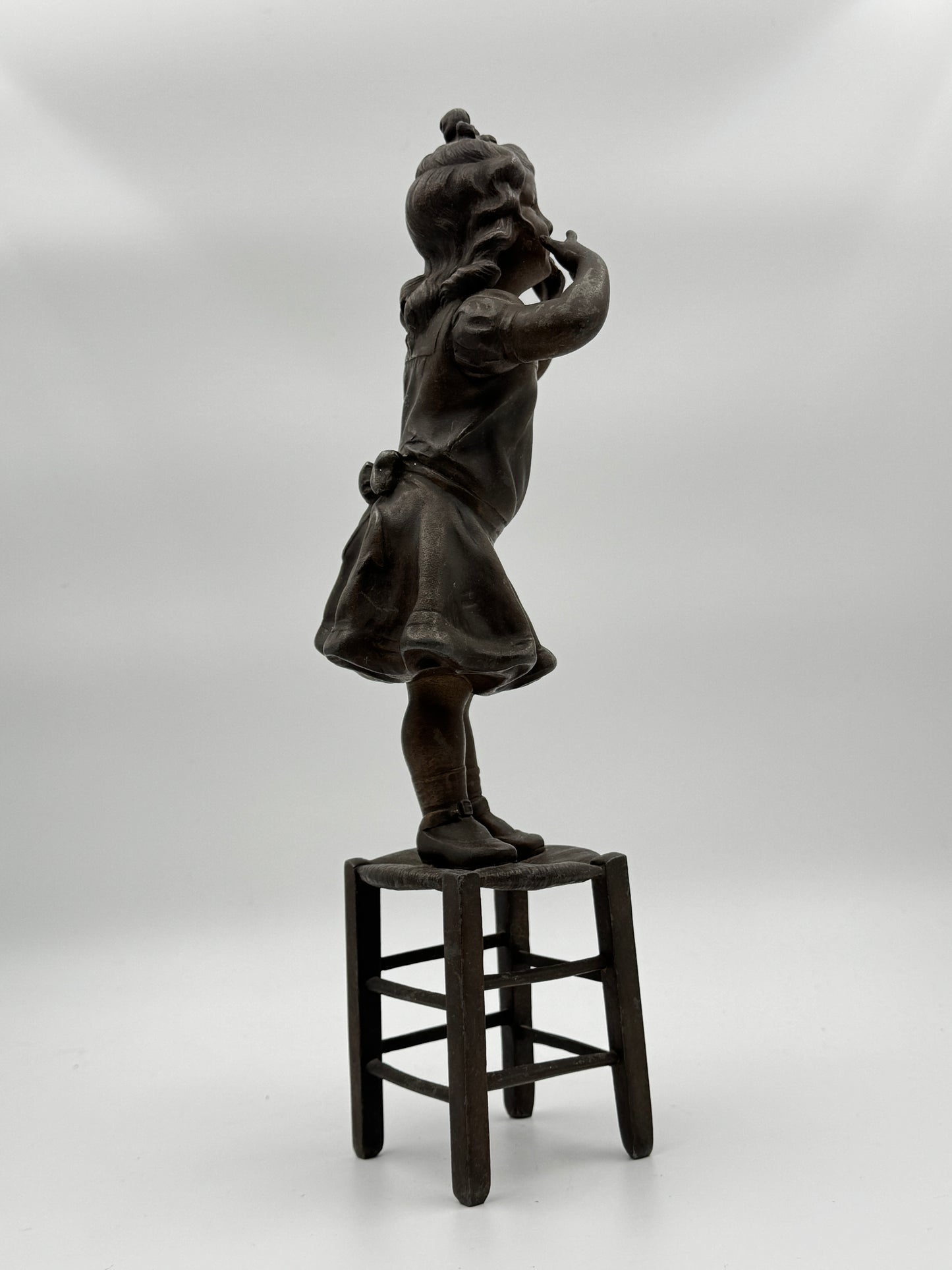 Vintage Patinated Metal Sculpture of a Girl Standing on a Chair