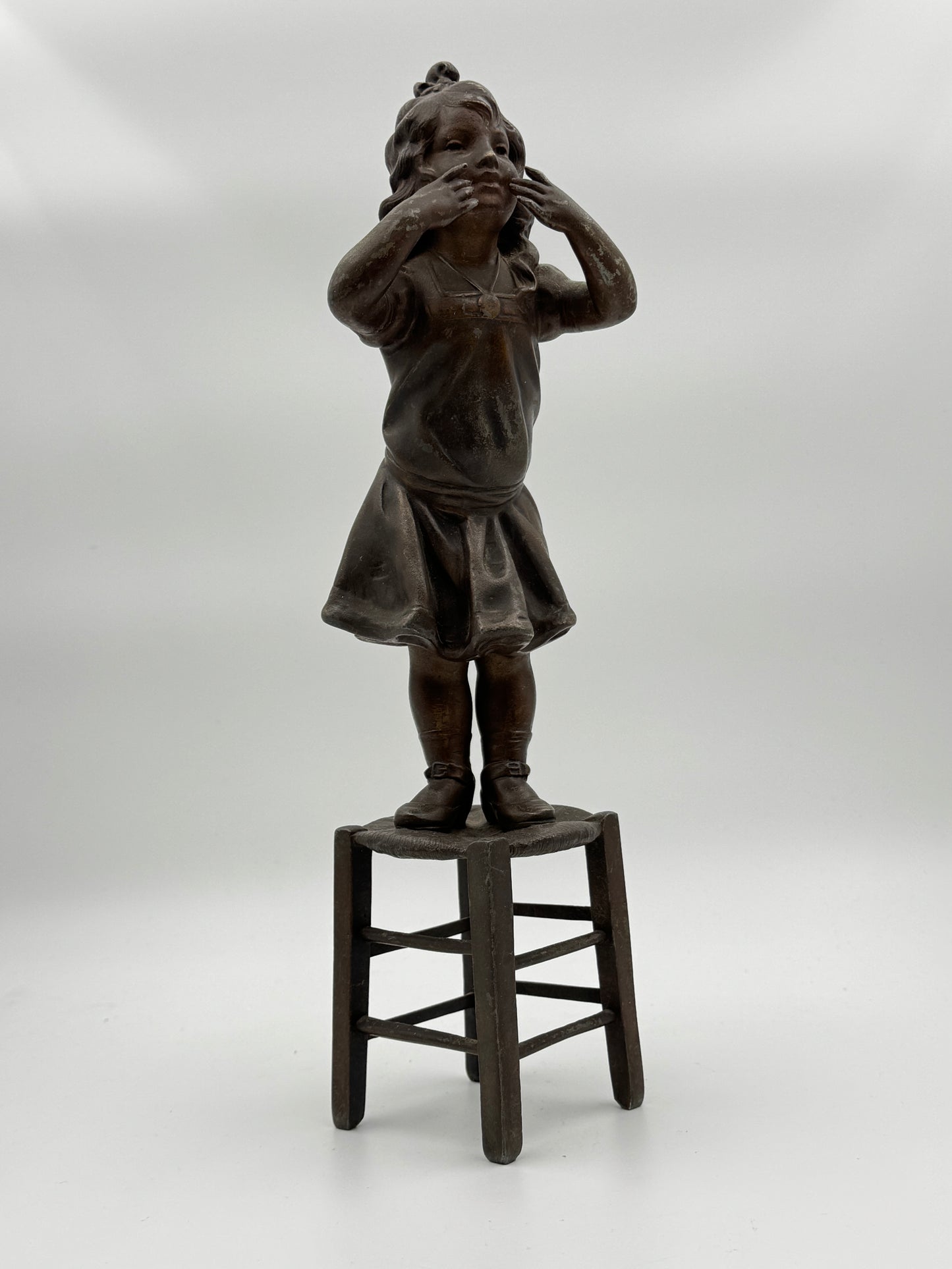 Vintage Patinated Metal Sculpture of a Girl Standing on a Chair