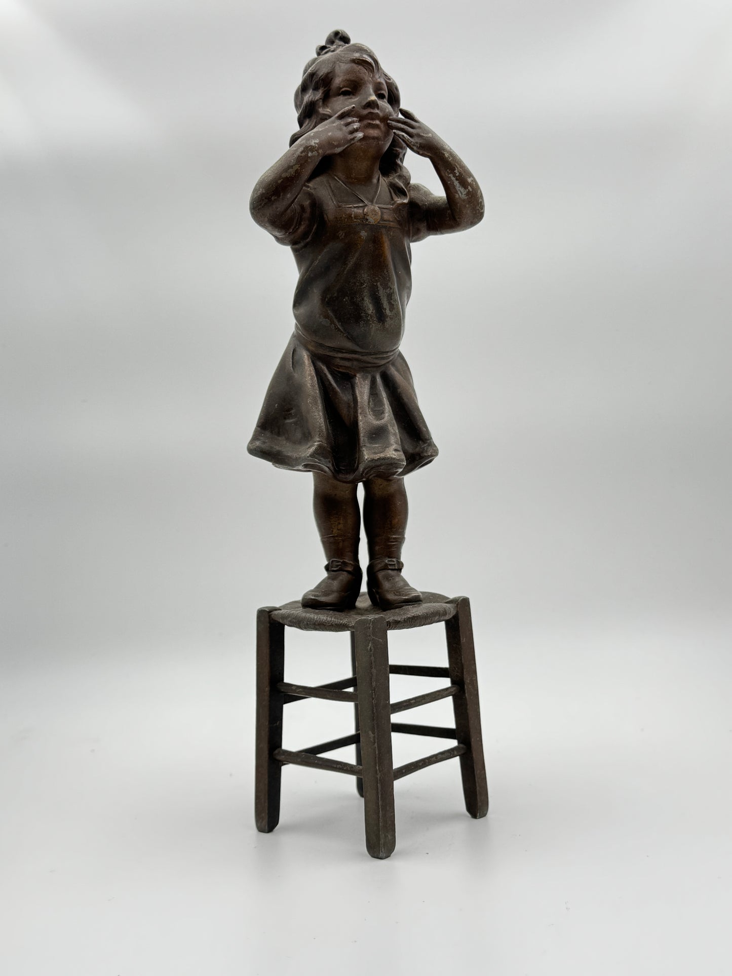 Vintage Patinated Metal Sculpture of a Girl Standing on a Chair