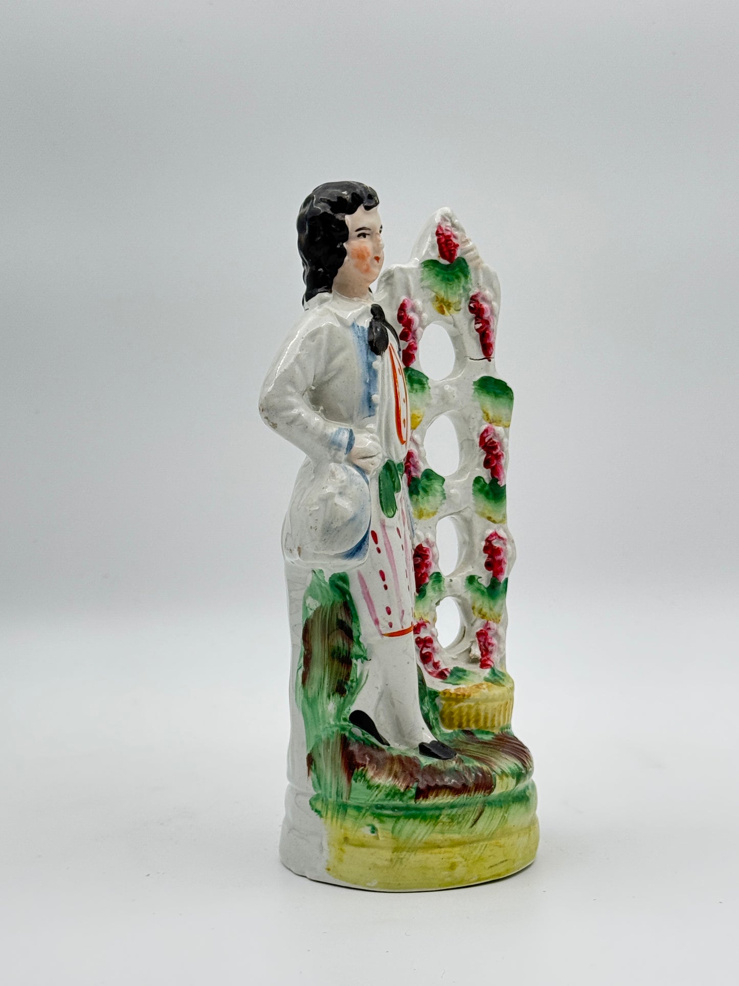 Antique Staffordshire Pottery Figure of a Man Standing by a Grape Arbor – 19th-Century English Collectible