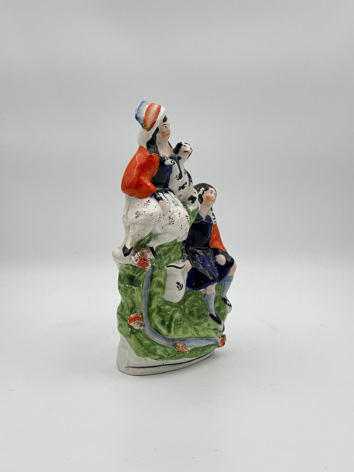 Antique Staffordshire Pottery Figurine – Woman with Dog and Man in Vibrant 19th-Century Scene