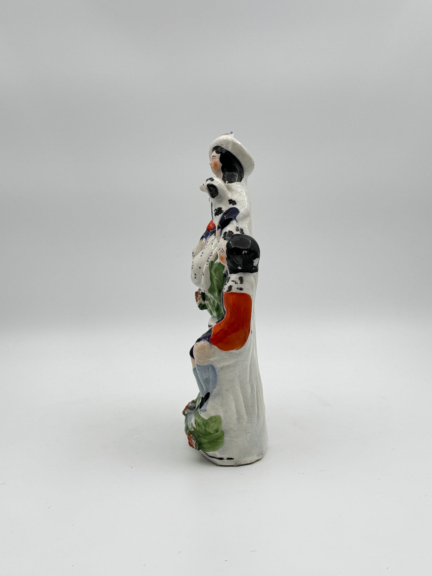 Antique Staffordshire Pottery Figurine – Woman with Dog and Man in Vibrant 19th-Century Scene