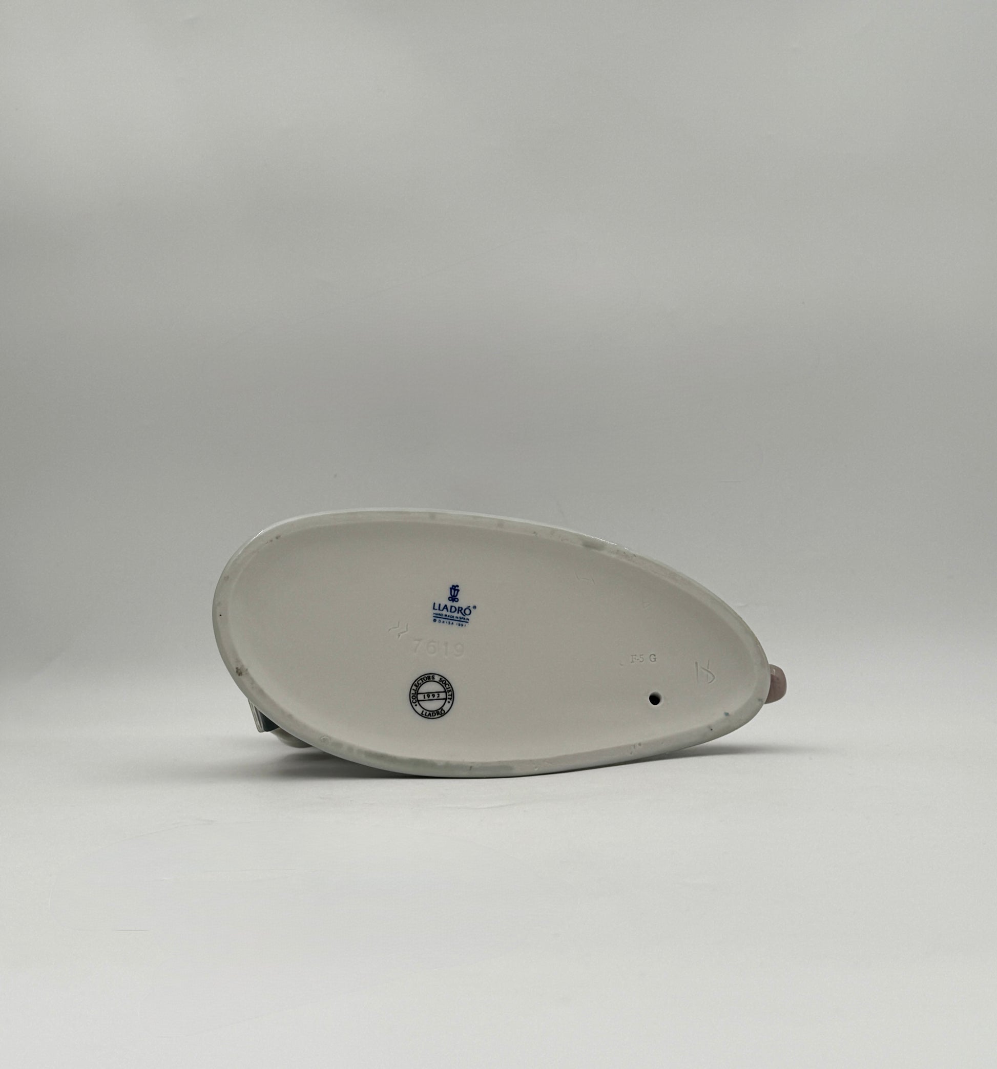 Lladró “All Aboard” #7619 Boy with Train Figurine