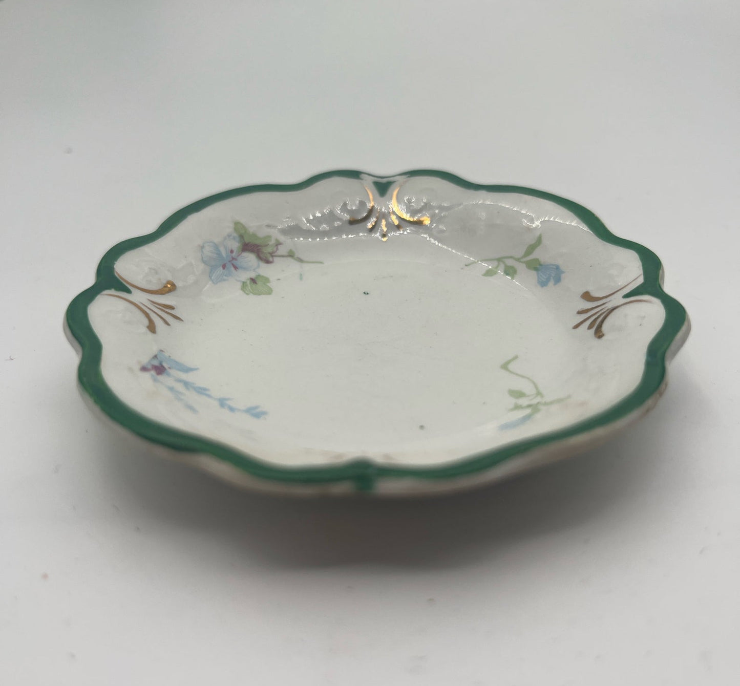 W.H. Grindley English Butter Pat – Green Rim with Floral Motif