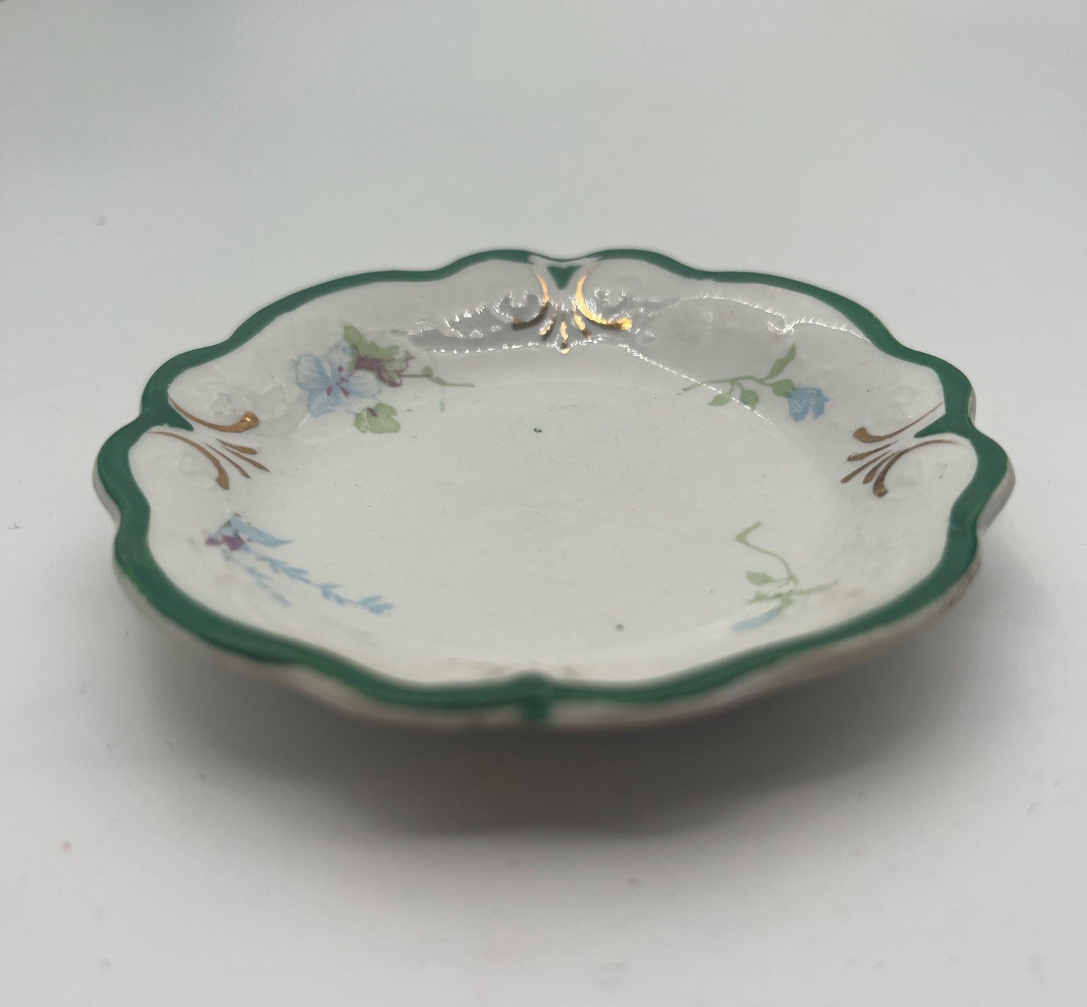 W.H. Grindley English Butter Pat – Green Rim with Floral Motif