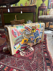 Vintage Suitcase With Travel Stickers