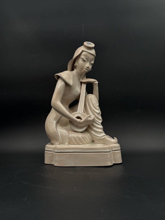 Japanese Woman Playing A Shamisen